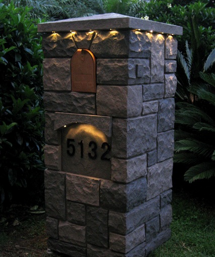 Fake stone mailbox columns come with a solar light kit under the cap.