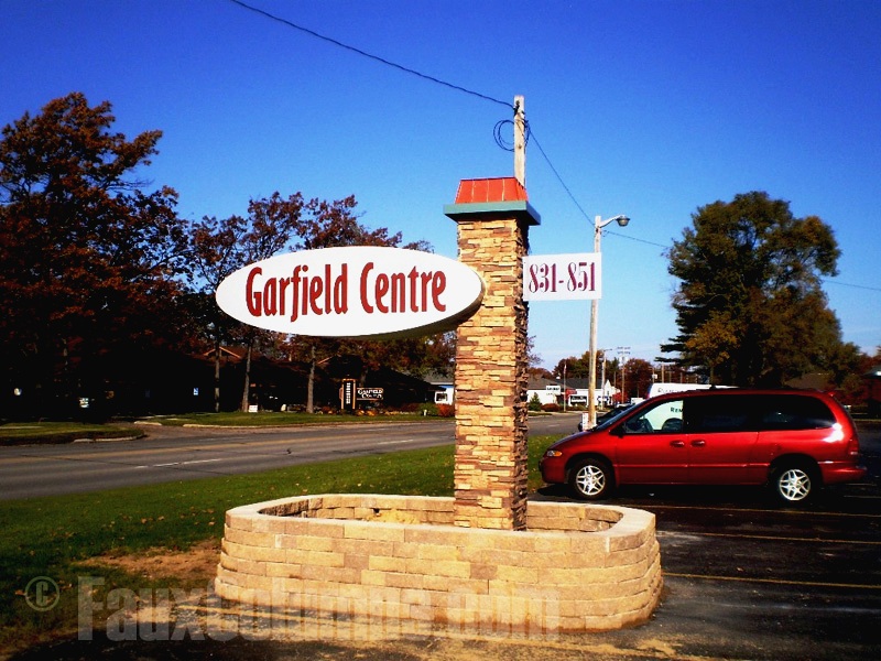 Outdoor business signs have enhanced visual appeal with decorative columns.