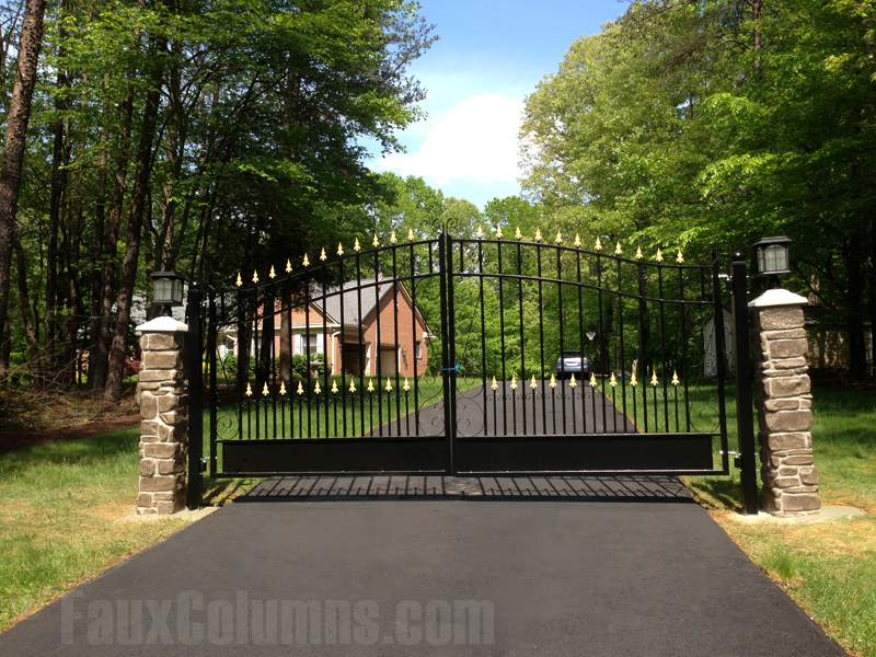 Stone veneer columns flanking driveway entrances adds to curb appeal. 