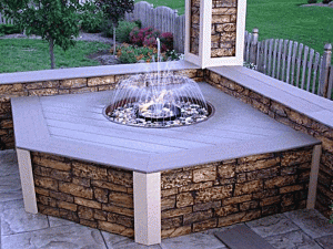 Patio water fountain sided with stone look panels.