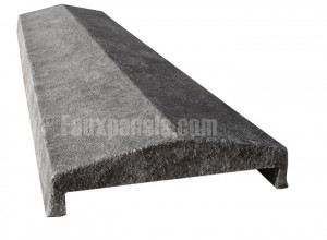 A faux stone wall cap