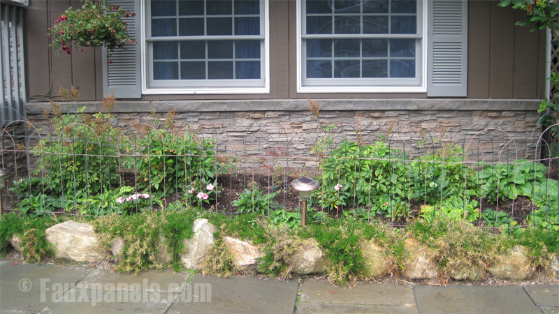 Faux stone panels on the foundation