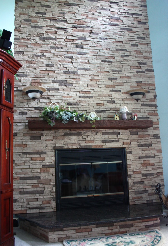 Remodeled fireplace surround on an angled wall using Wellington Dry Stack panels and new mantel.