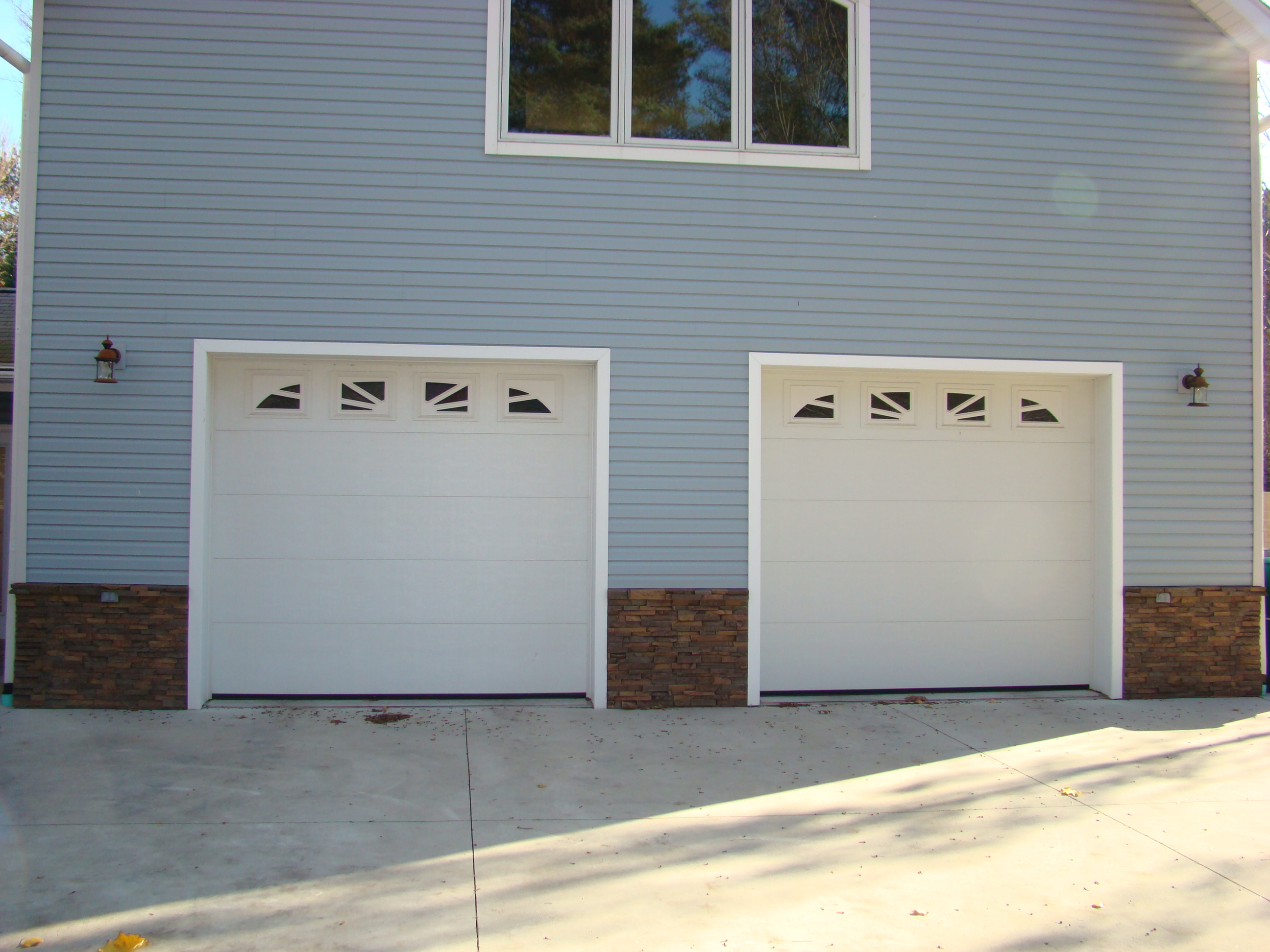 Wainscoting panels fit snugly between garage doors.