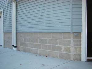 This home's exterior wainscoting was bland and boring concrete block.