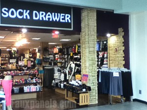 Faux stone panels and corners were used together to create this unique storefront design featuring minimalist accent walls and decoartive columns to welcome customers.