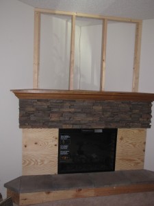Halfway done, this pic highlights the incredible transformation in progress. The panels were mounted onto the face of the removable fireplace.