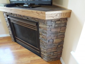 Fireplace with mitered corners at a 45 degree angle to fit to the wall beautifully.