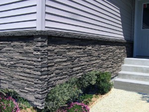 Mobile home foundation with the appearance of traditional stonework without the cost or weight of the real thing.