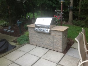 Using artificial stone paneling, Fred was able to give his grill a completely new look that enhanced the appeal of his backyard.