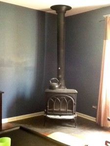  BEFORE: This amazing wood burning stove looked out of place with the modern, painted walls.