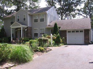 Using the beautiful cultured stone panels on the entranceway and garage created a great new look.