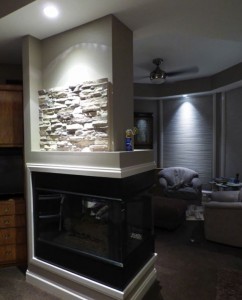 Faux panels start going up on this fireplace remodel.