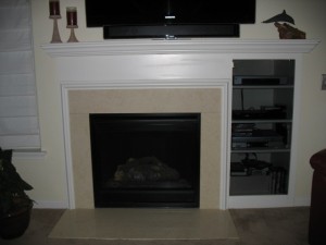 BEFORE: Dated and drab, the original fireplace was in dire need of a new look.