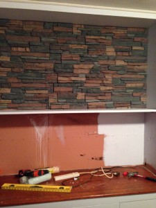 DURING: The panels attached directly the existing wall. Paint completed the rest of the transformation.