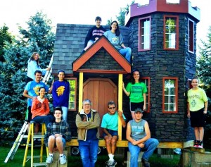 Venture Crew 630 pose in front of the Enchanted Castle of Dreams for the Make-a-Wish Foundation