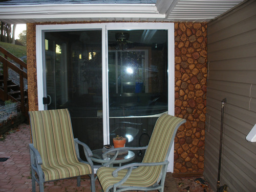 River Rock panels in Tan cover and protect this patio wall beautifully.