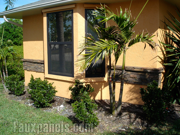 Drystack panels create a decorative border accent on this home's exterior.