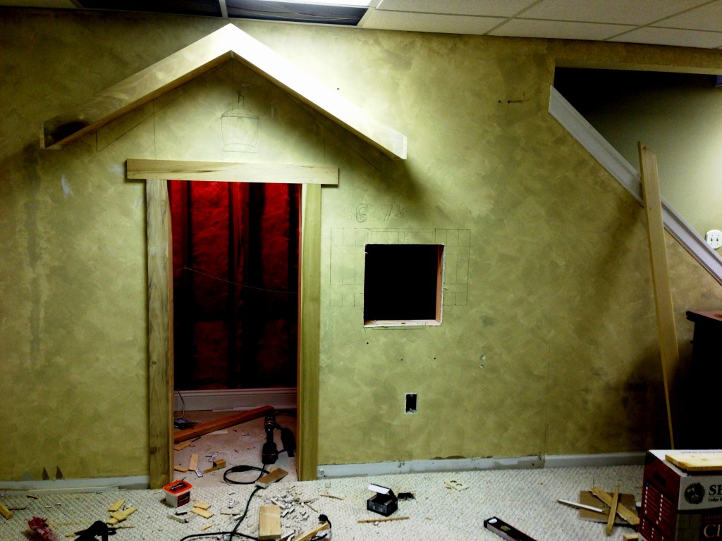 Indoor playhouse before photo.