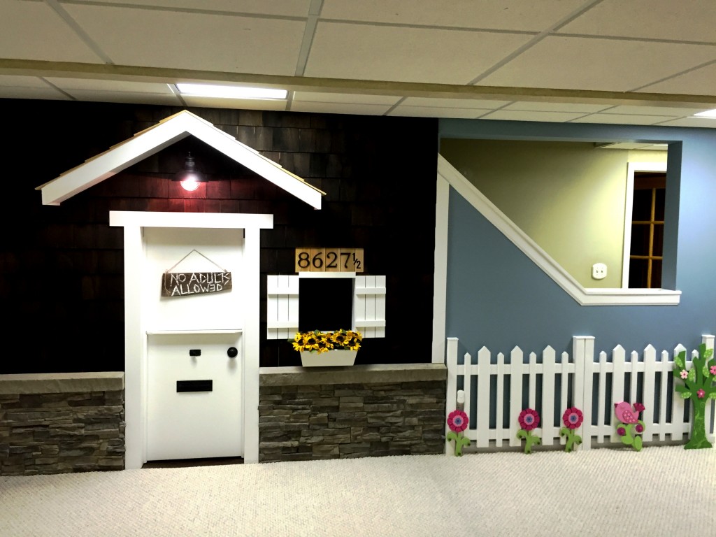 Artificial stacked stone panels add a cozy finishing touch to the playhouse.