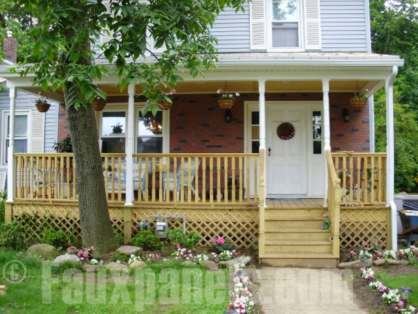 Faux brick panels create an a cozy backdrop for this home's front porch.