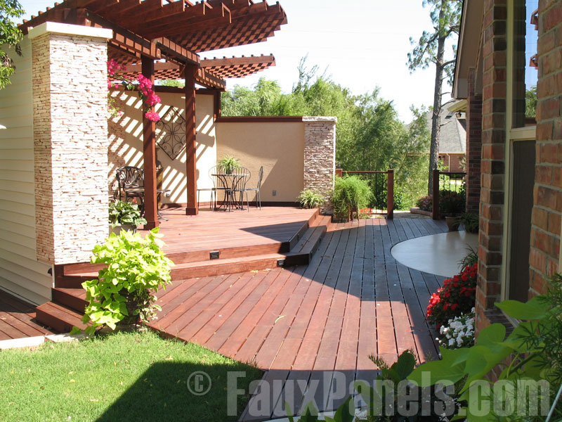 Stonewall panels create pillars to mark the ends of this patio space.