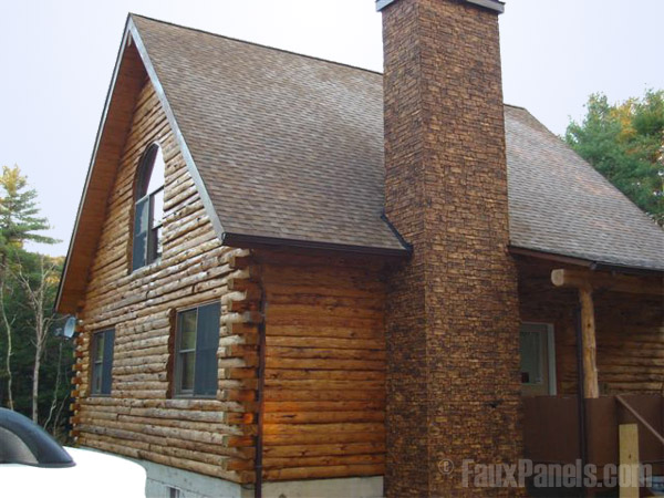 Log cabin with chimney covered in Oxford Stonewall panels.
