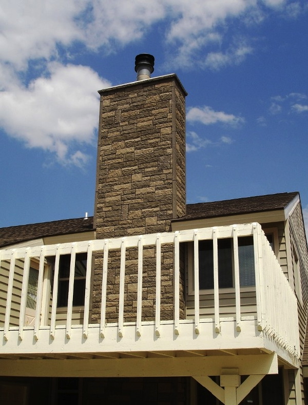 A chimney surround made of Windsor Random Rock panels has the look of professional masonry.