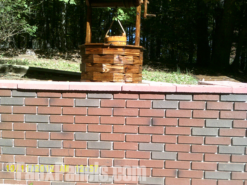 Retaining wall sided with Carlton brick panels in Bordeaux color.