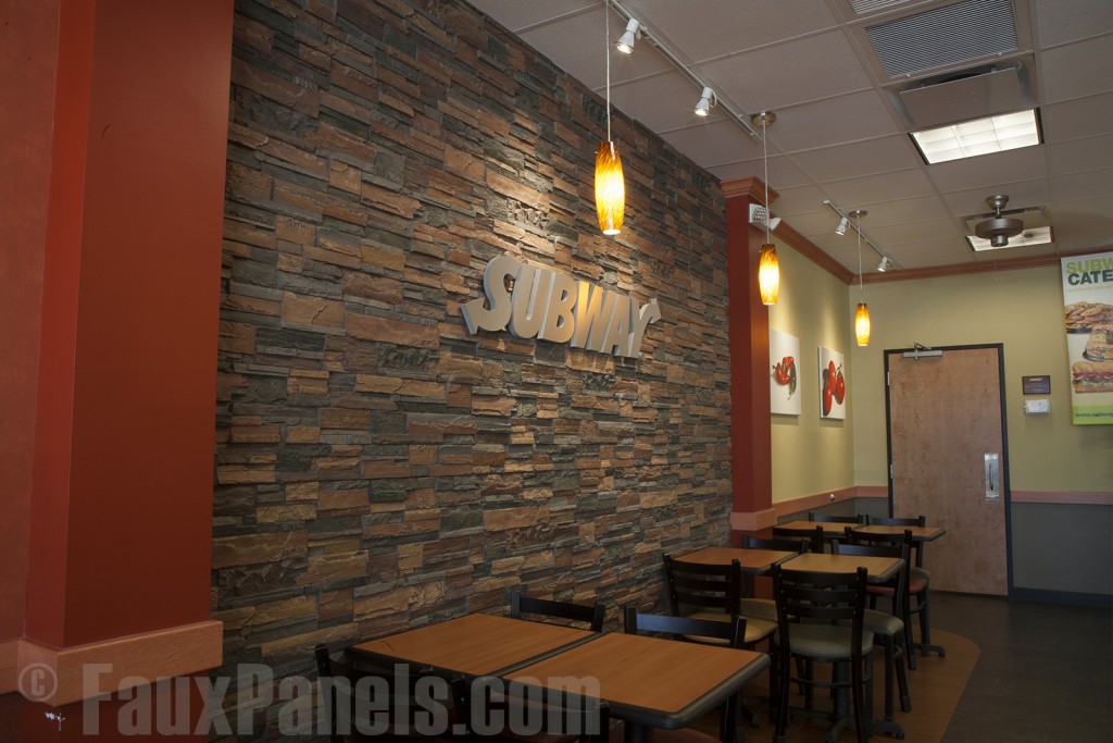 A Subway franchise gains a cozy atmosphere with dry stack paneling.