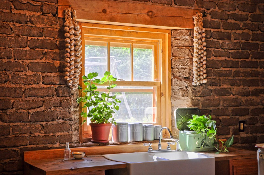 Garden herbs by the window make for refreshing kitchen remodeling ideas.