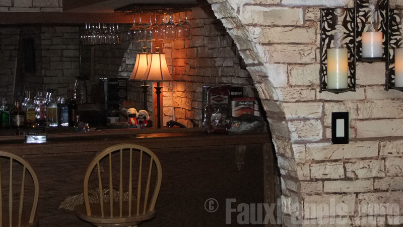 Faux stone panels add charm and visual appeal to home bars.