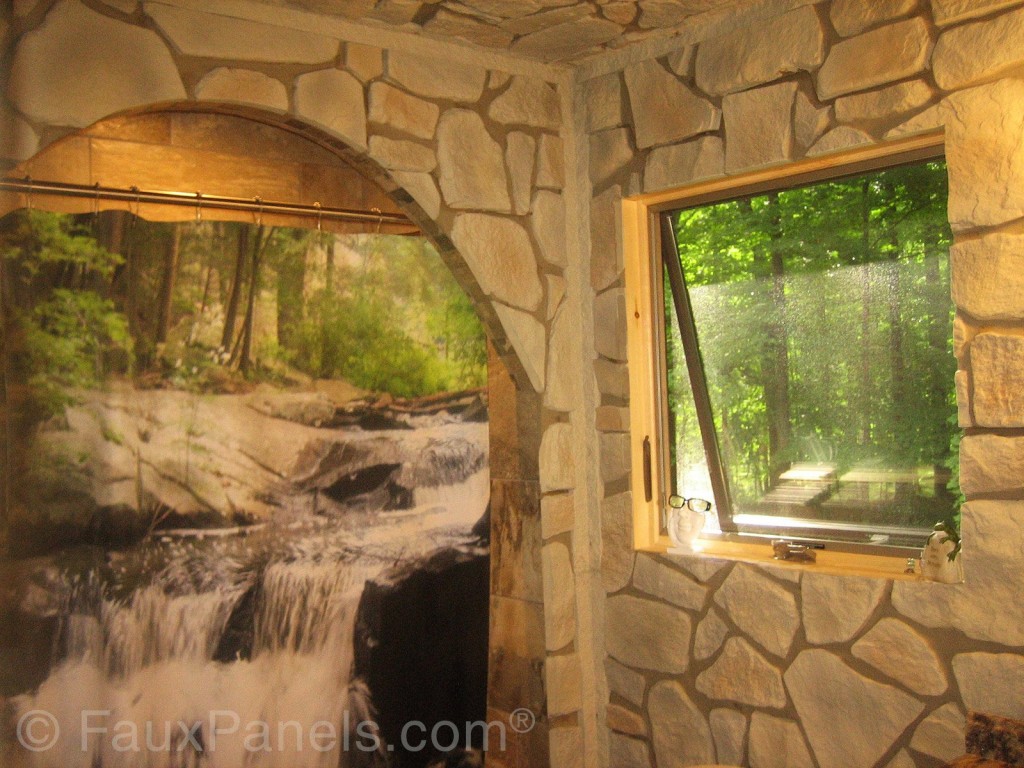 Fieldstone style bathroom wall panels with corners covered with mortar.