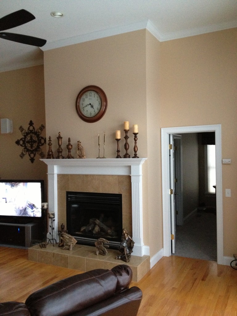  BEFORE: You can see how boring the plain wall was, but also see how the installed panels were cut to accommodate the existing mantel.
