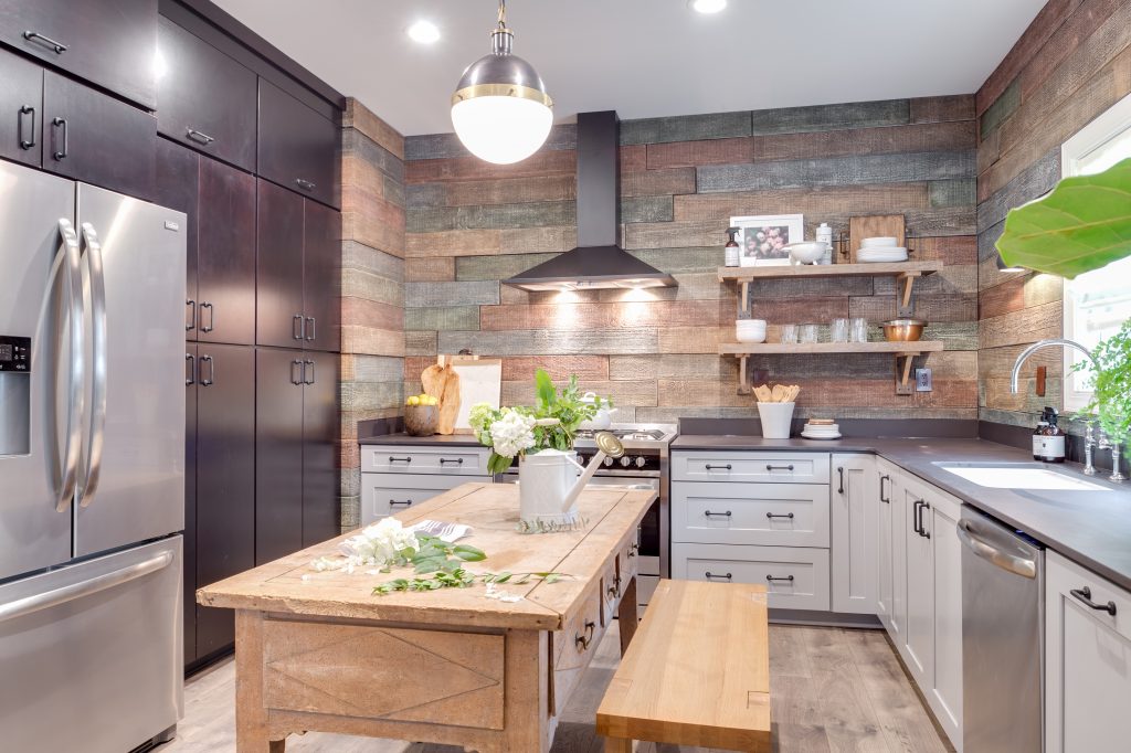 Amazing kitchen of the ranch style home built on Season 2, Episode 2 of TV's Home Free, with Reclaimed Barn Board panels on the walls.