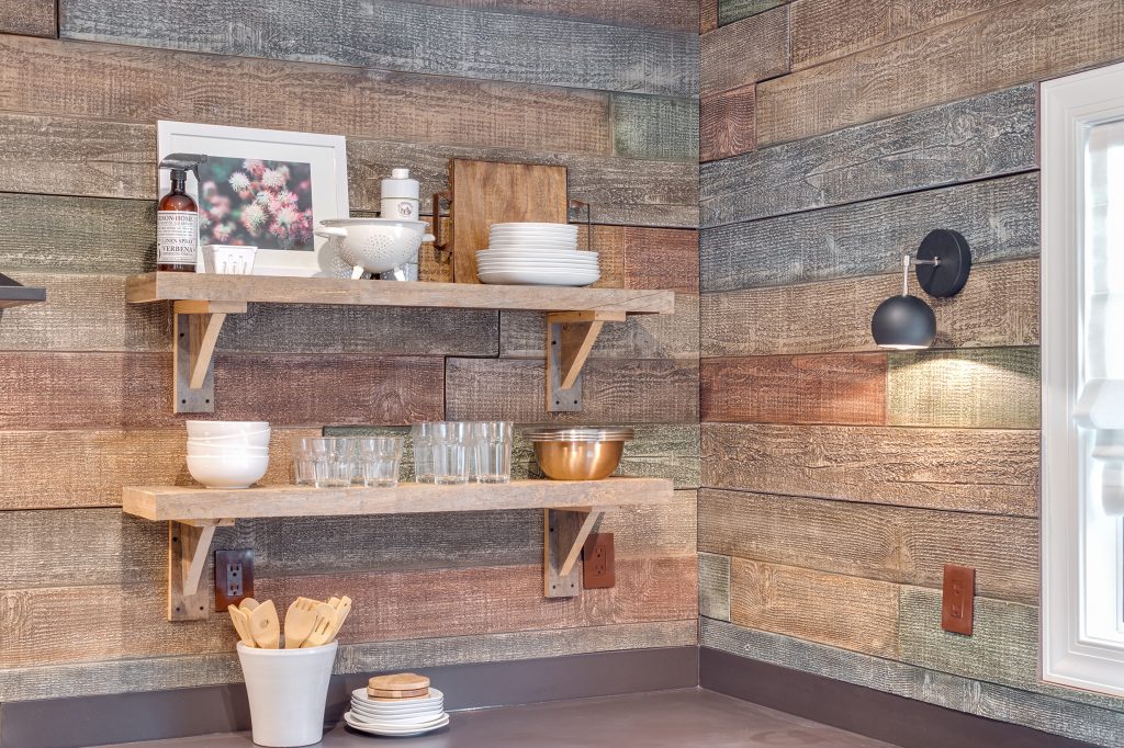 Close up view of kitchen backsplash built on the Home Free TV show, made from water-resistant wood style panels.