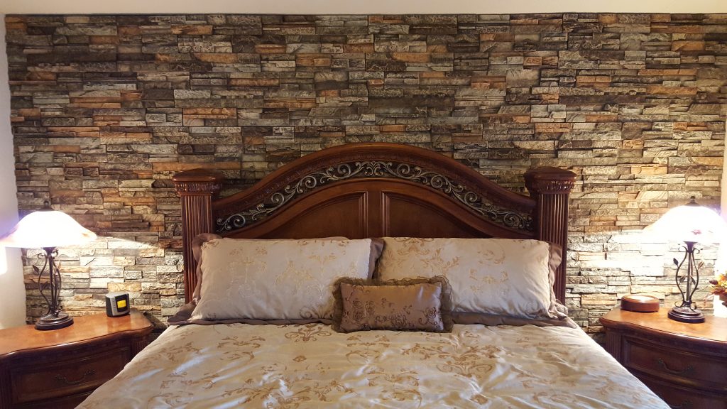 Bedroom accent wall made with polyurethane panels molded from real dry stacked stone.