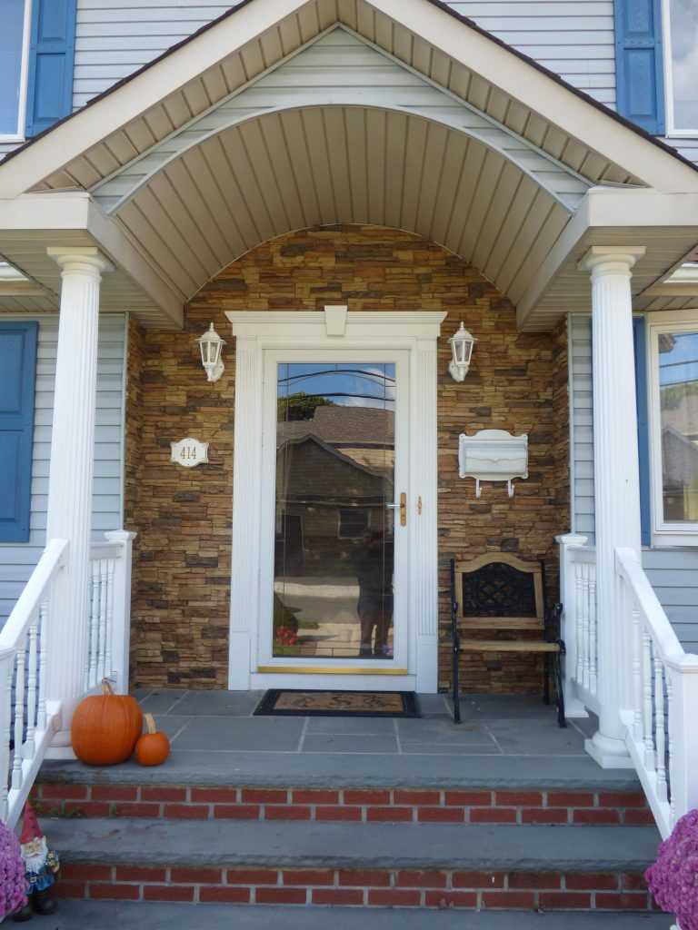 AFTER: This home's front entrance is transformed with its new stacked stone facing