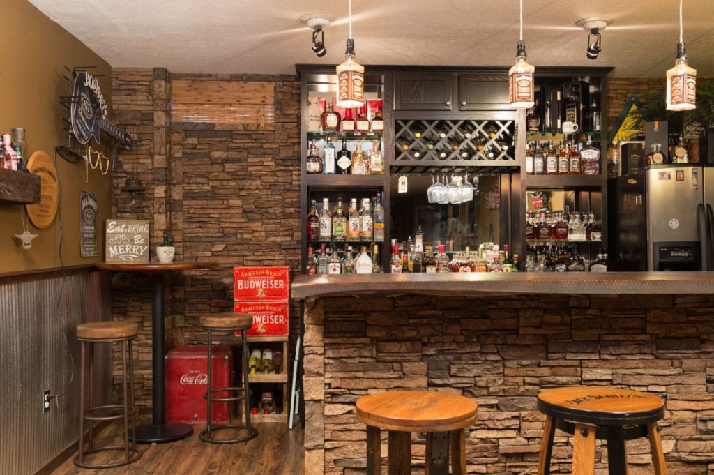 Incredible new wetbar built by the homeowner in her basement, finished with stacked stone style panels.