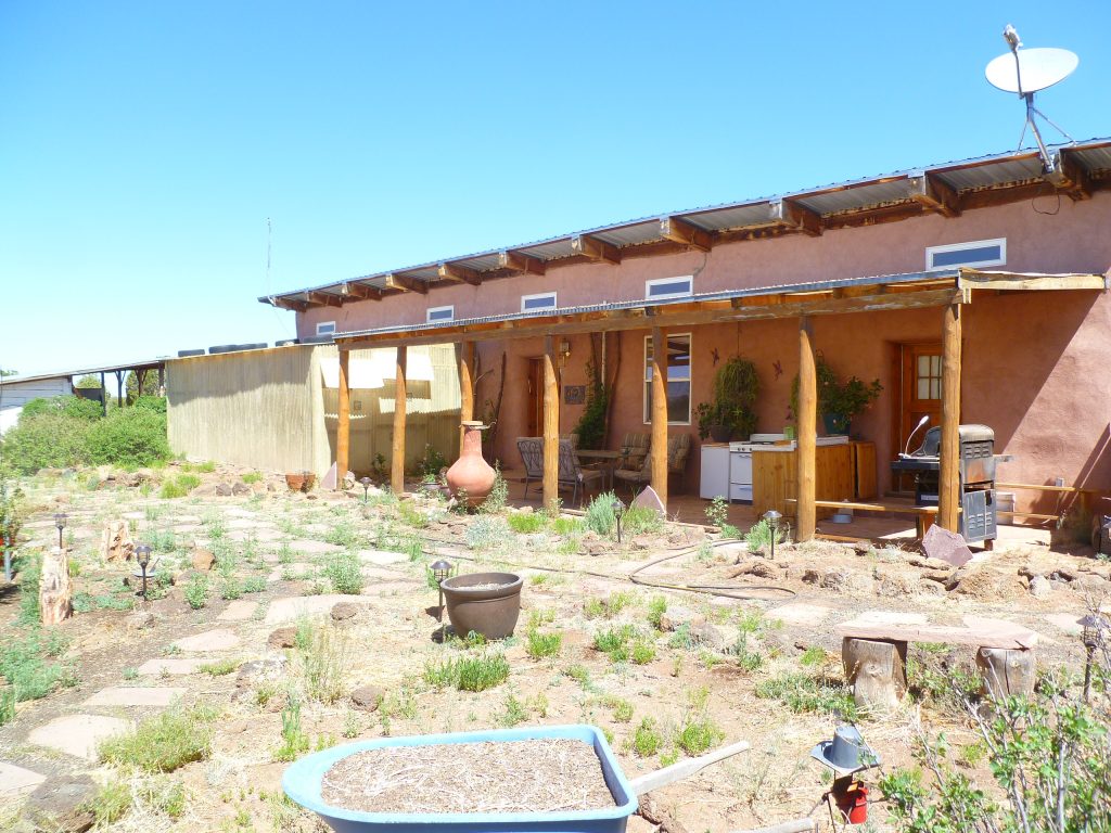 BEFORE: With his rusting grill and lack of furniture, you can see why Kress wanted a proper outdoor eating solution.