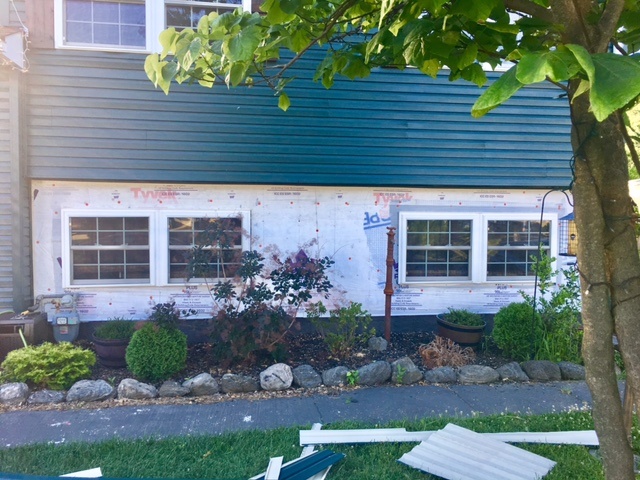 Existing siding removed.