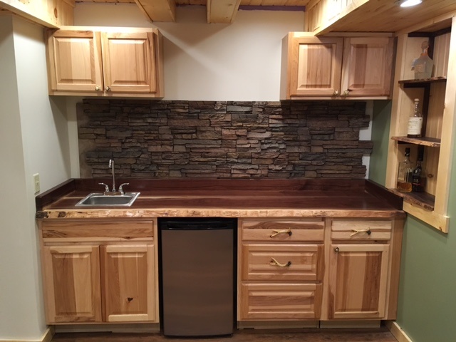 The first row of panels is in the process of being installed as a kitchen backsplash.