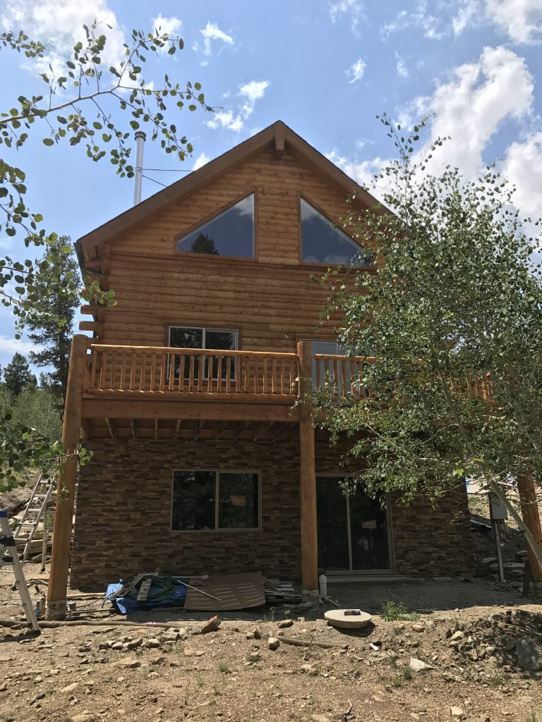 The combination of authentic log timber and faux stacked stone looks amazing.