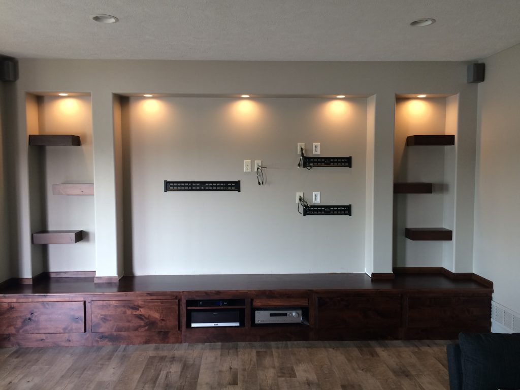 BEFORE: Man cave media center with mounting brackets installed for the flatscreens.