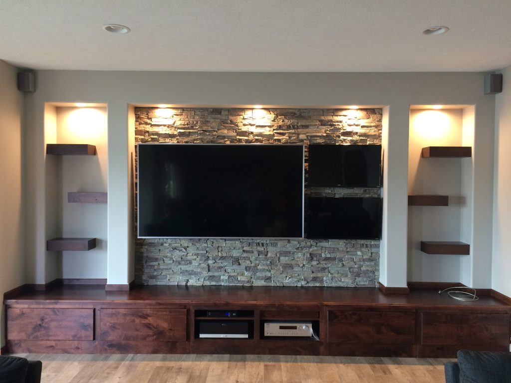 Rustic man cave's new media center finished with Regency Stacked Stone panels in Misty Morning color.