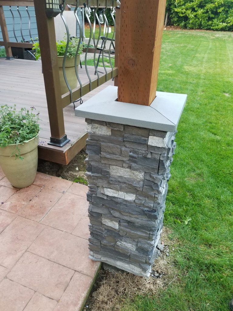 Patio column base made from Norwich Stacked Stone wrap with decorative cap.