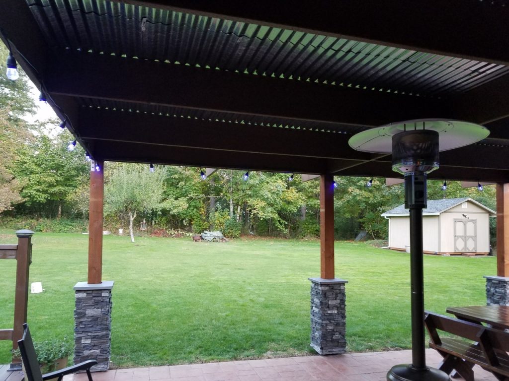Patio columns with bases made from Norwich Stacked Stone column wraps.