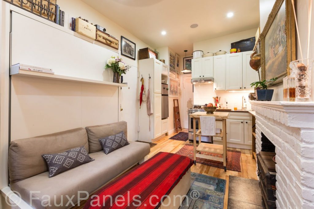 Small apartment with fireplace covered in Glacier White brick veneer.