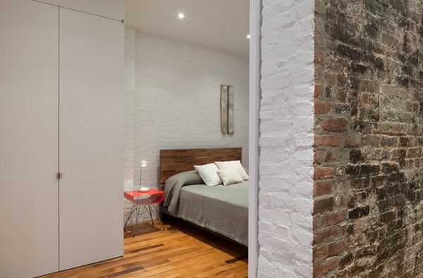  In this warehouse-turned-apartment block, painting the bedrooms white helps make them look brighter and cleaner.