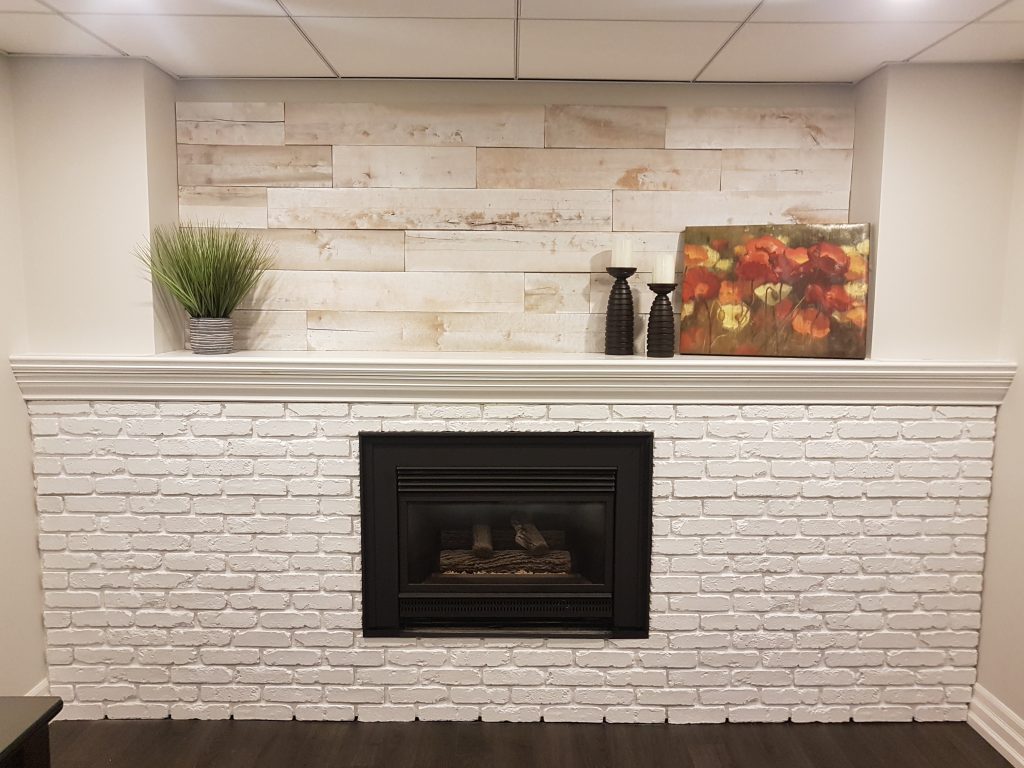 Faux white brick fireplace lightens up a basement.